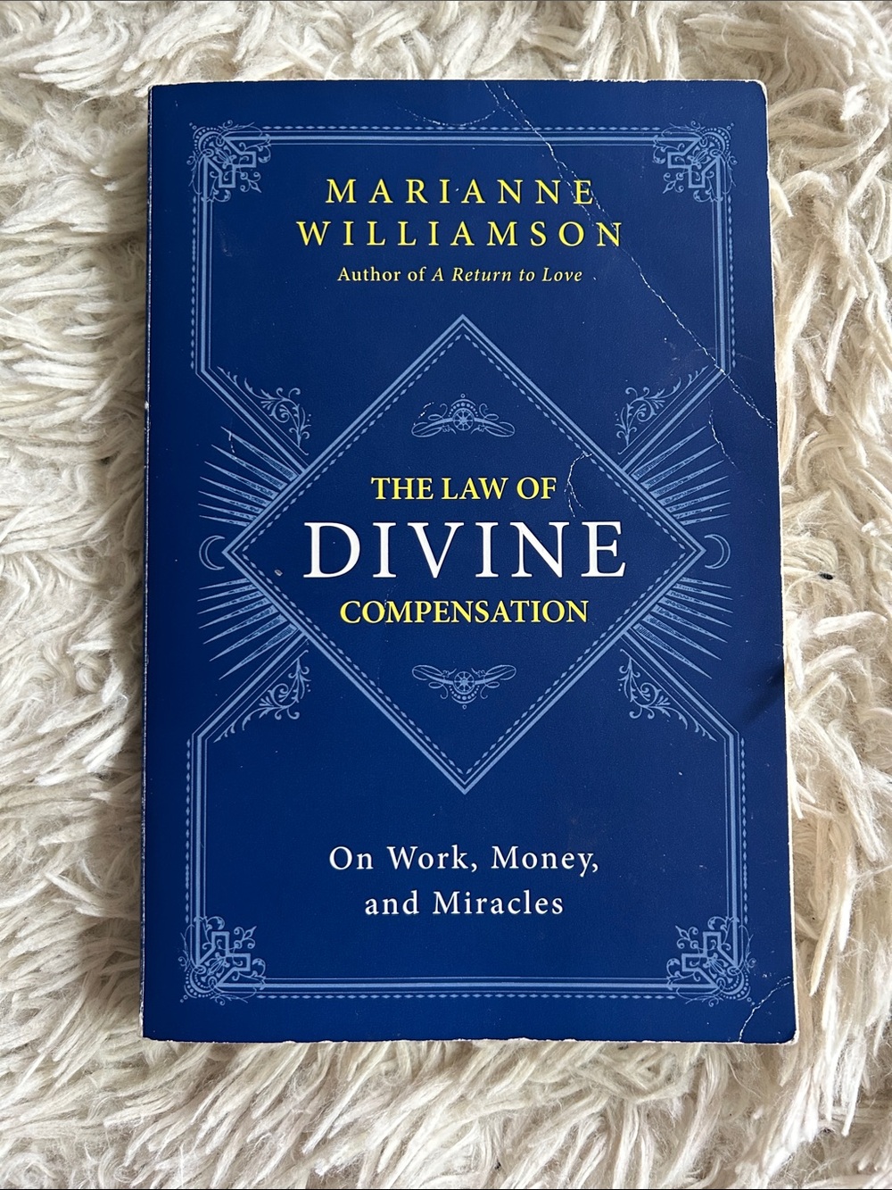Marianne Williamson "The Law of Divine Compensation" paperback Book - Navy Blue